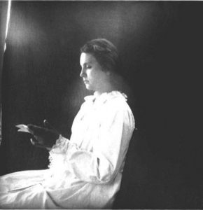 Portrait in profile of a woman reading. Moorefield, Arkansas. 1899-1900.