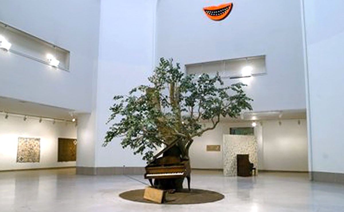 piano in front of tree in an atrium